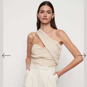 Atoir “Never Really Over” Bodysuit in a creamy taupe color.